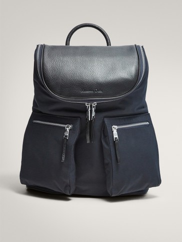 contrast navy blue leather and fabric backpack