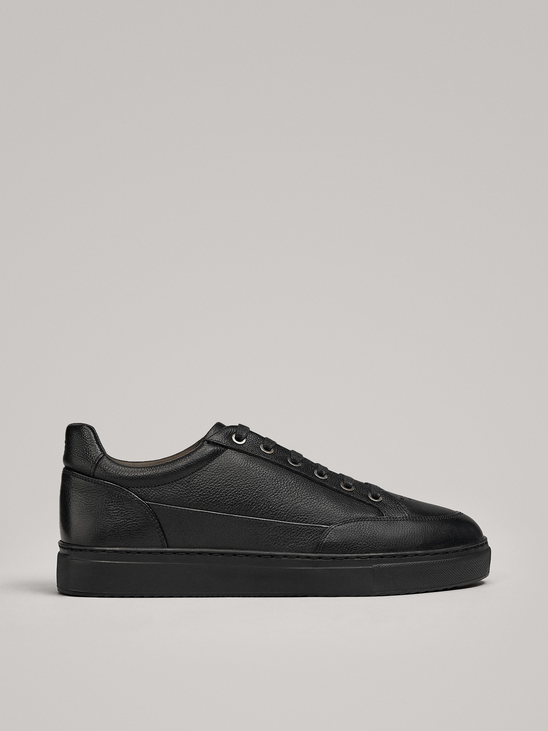 black leather plimsolls