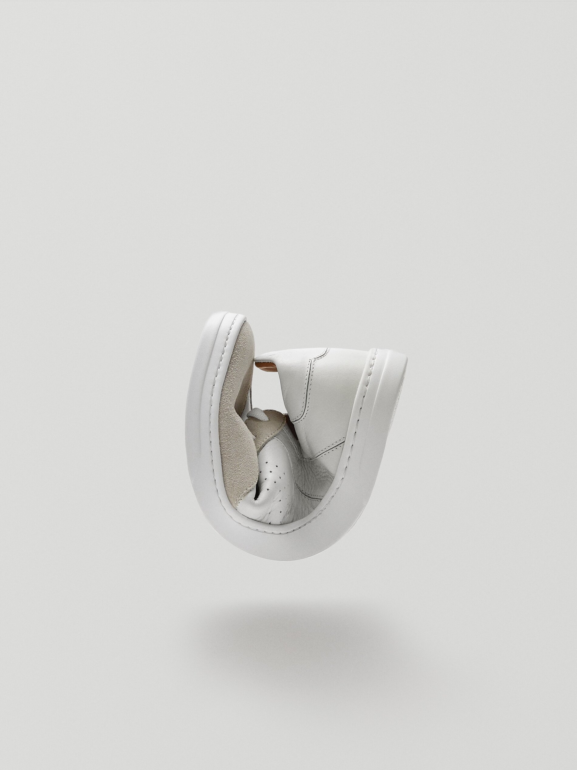 white soft leather trainers