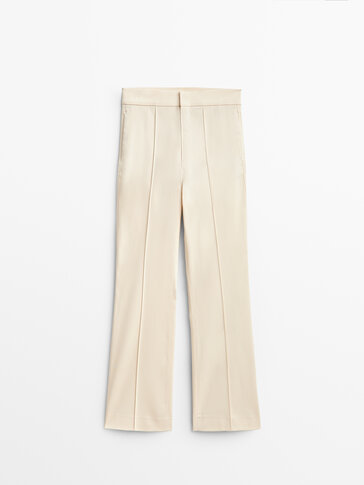 Flared trousers with central seam