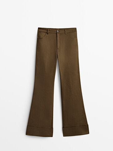 Flared trousers with turn-up hems