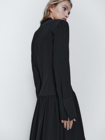 Black dress with flounced skirt