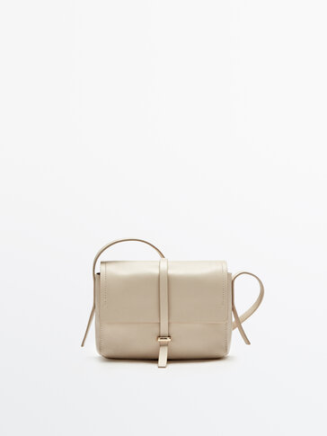Leather bag with flap and gold detail