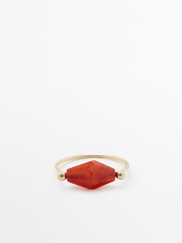 Ring with diamond-shaped stone