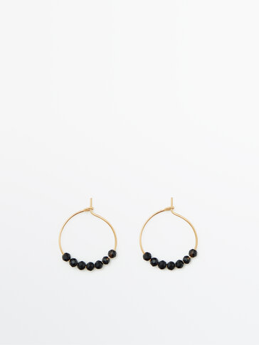 Gold-plated hoop earrings with black stones