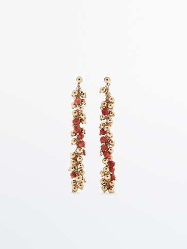Gold-plated dangle earrings with red beads