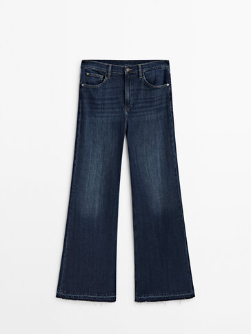 High-waist flared jeans with frayed hems