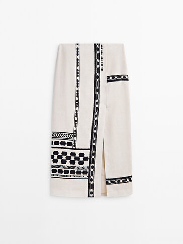 Midi skirt with opening and latticework detail