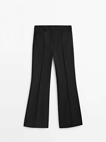 Flared trousers with central seam