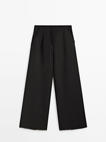 Darted black trousers with frayed hem