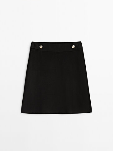 Short knit skirt with button detail