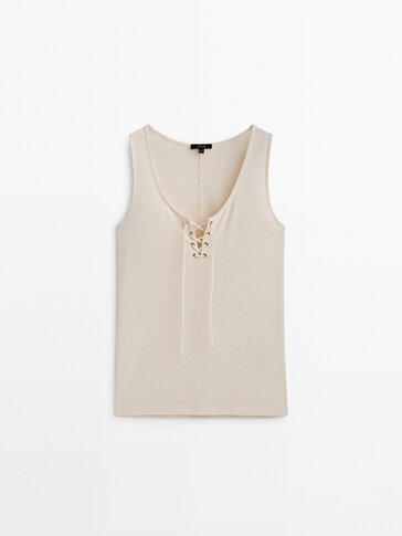 Sleeveless top with lace-up neckline