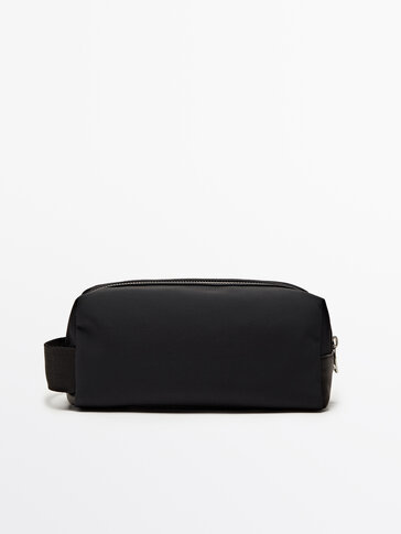 Toiletry bag with leather trims