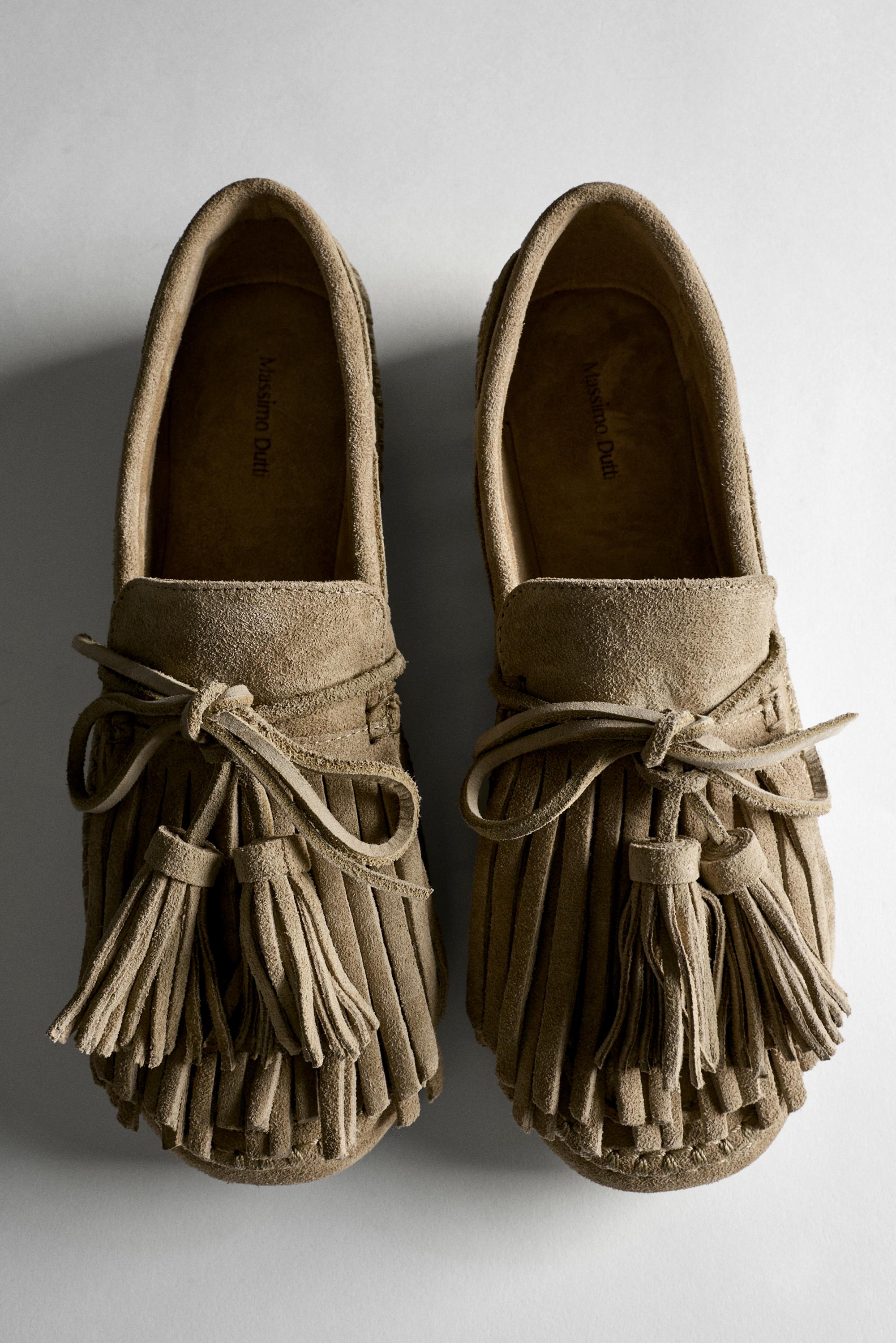 Leather loafers with fringing and tassels