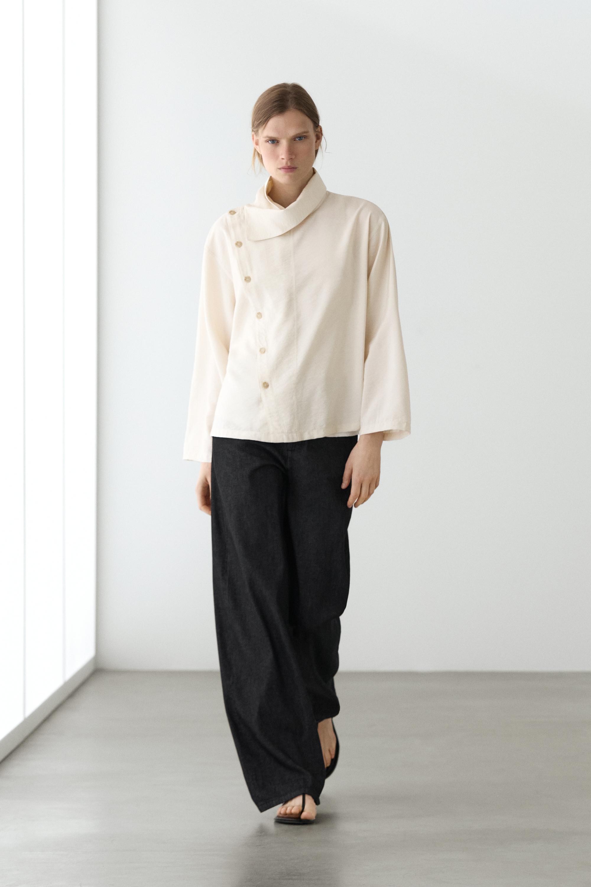 Flowing shirt with asymmetric buttons