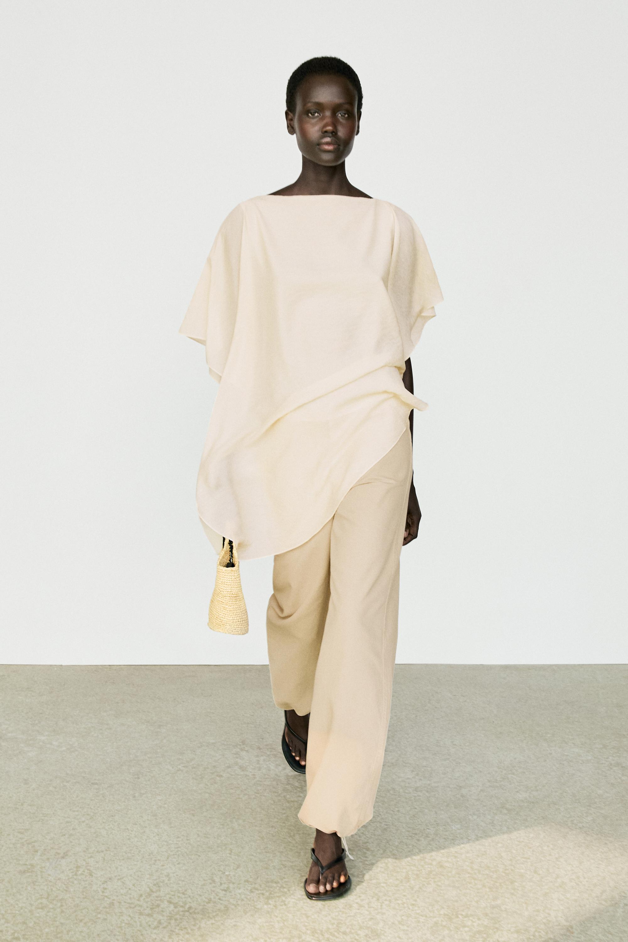 Asymmetric cape-style flowing blouse