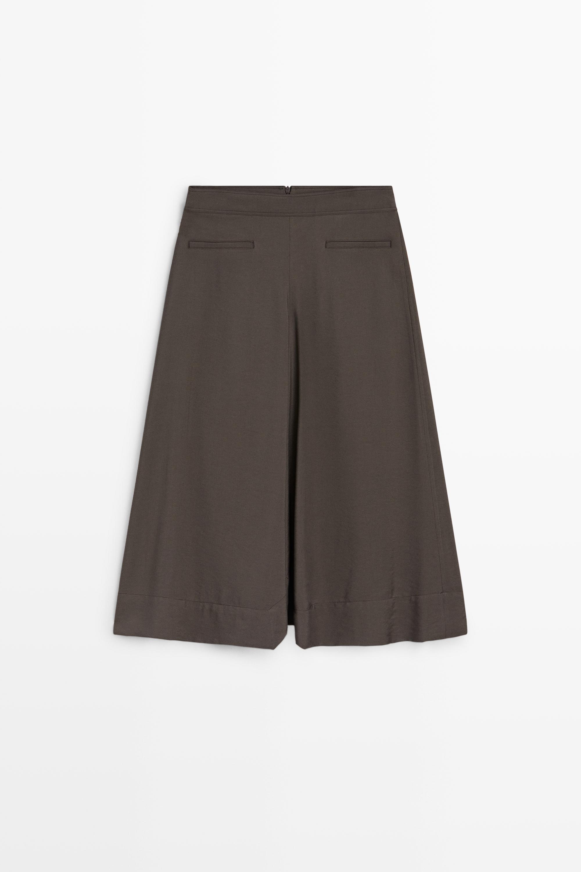 Flowing midi skirt with pleated detail