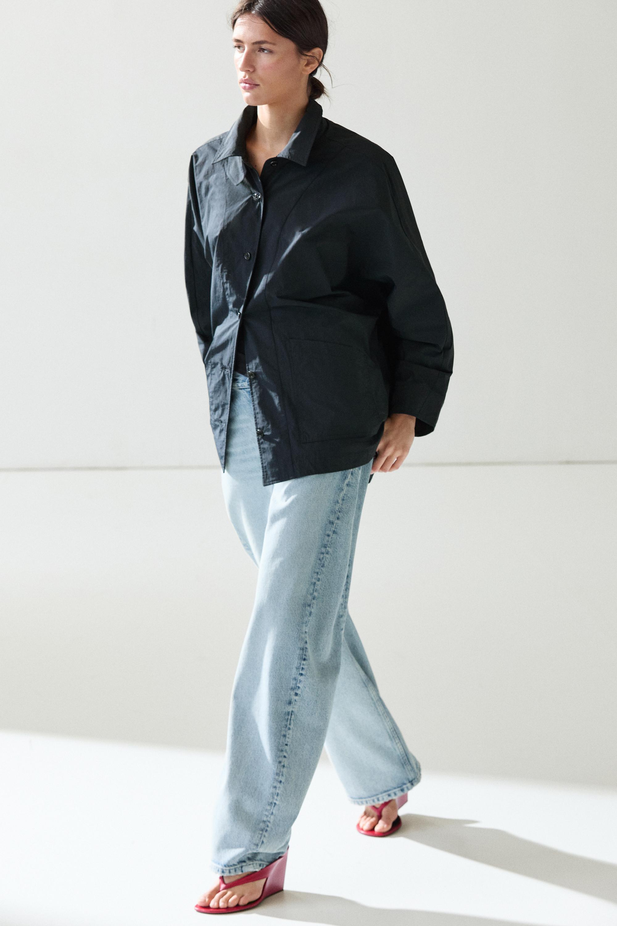 Jacket with buttoned collar strap