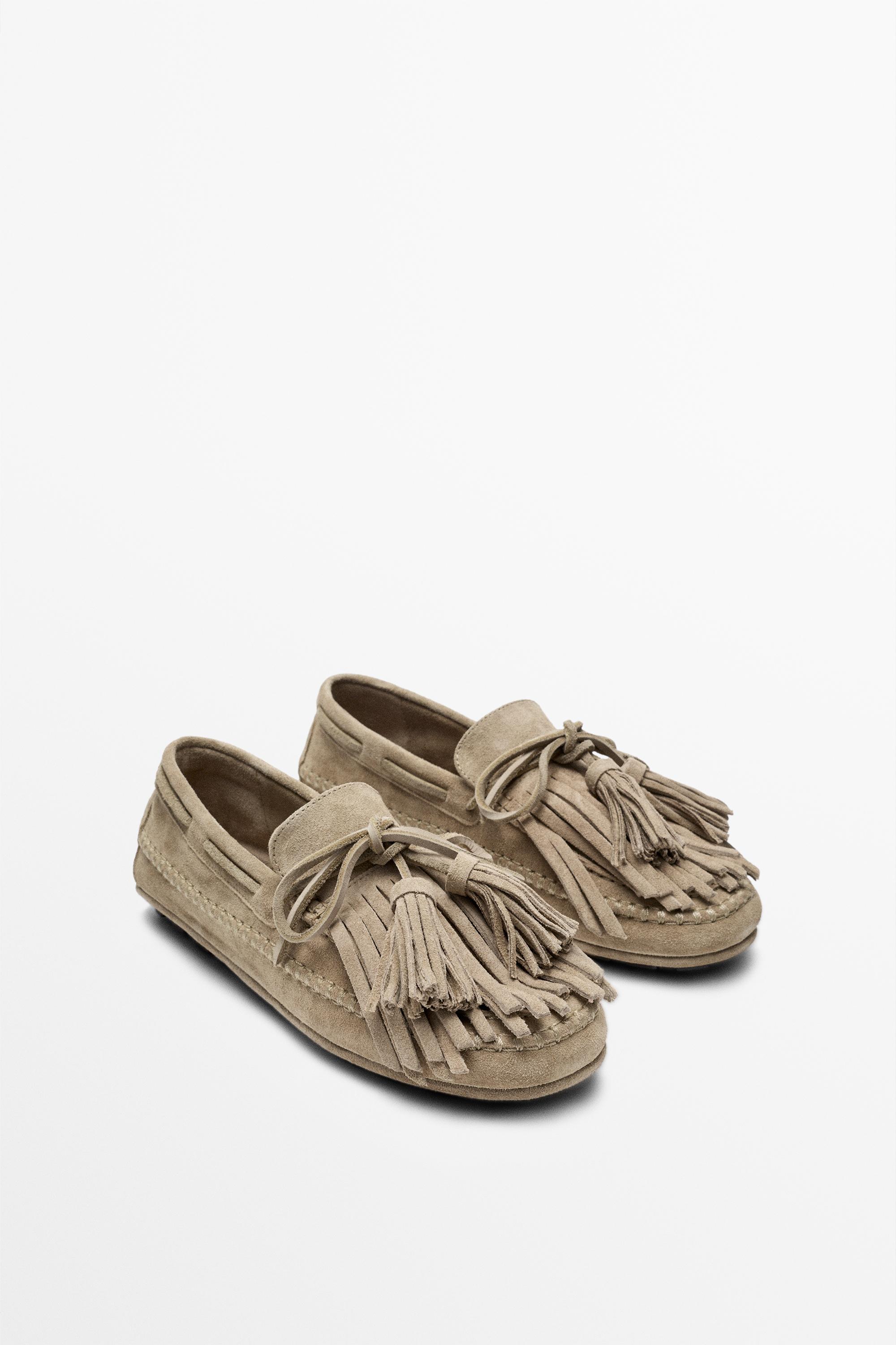 Leather loafers with fringing and tassels