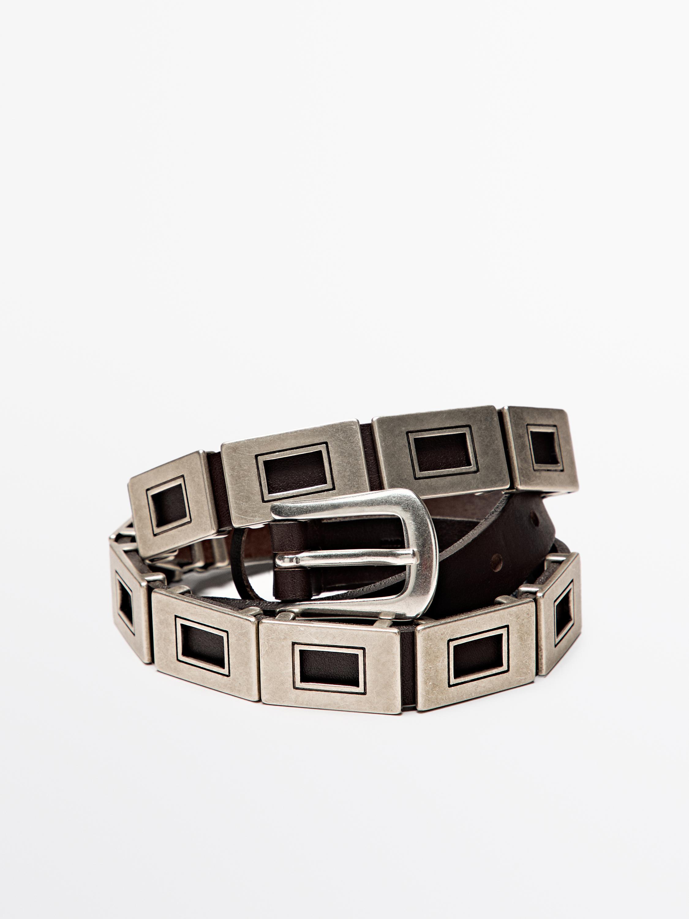 Belt with metal appliqués