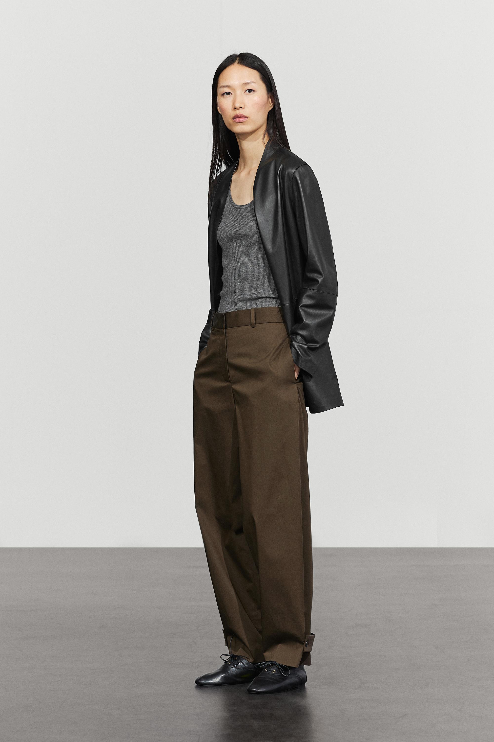 Pants with button-tab hem detail
