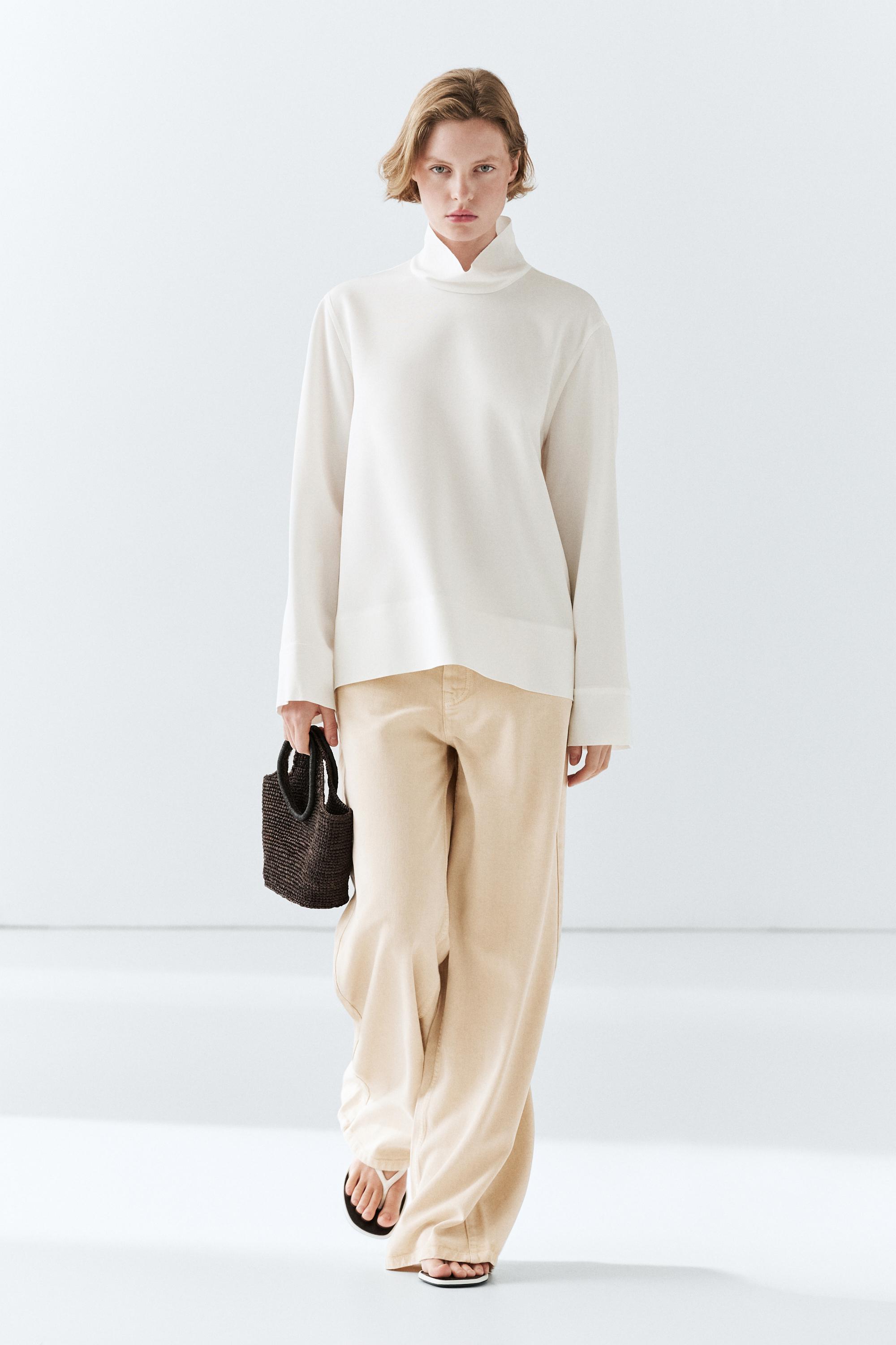 High neck blouse with hem detail
