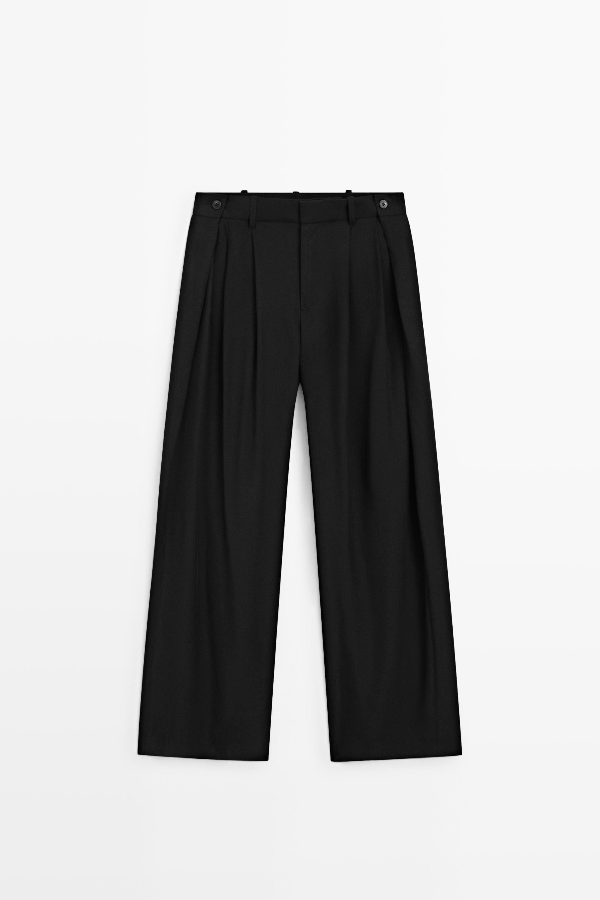 Flowing pleated pants with button detail