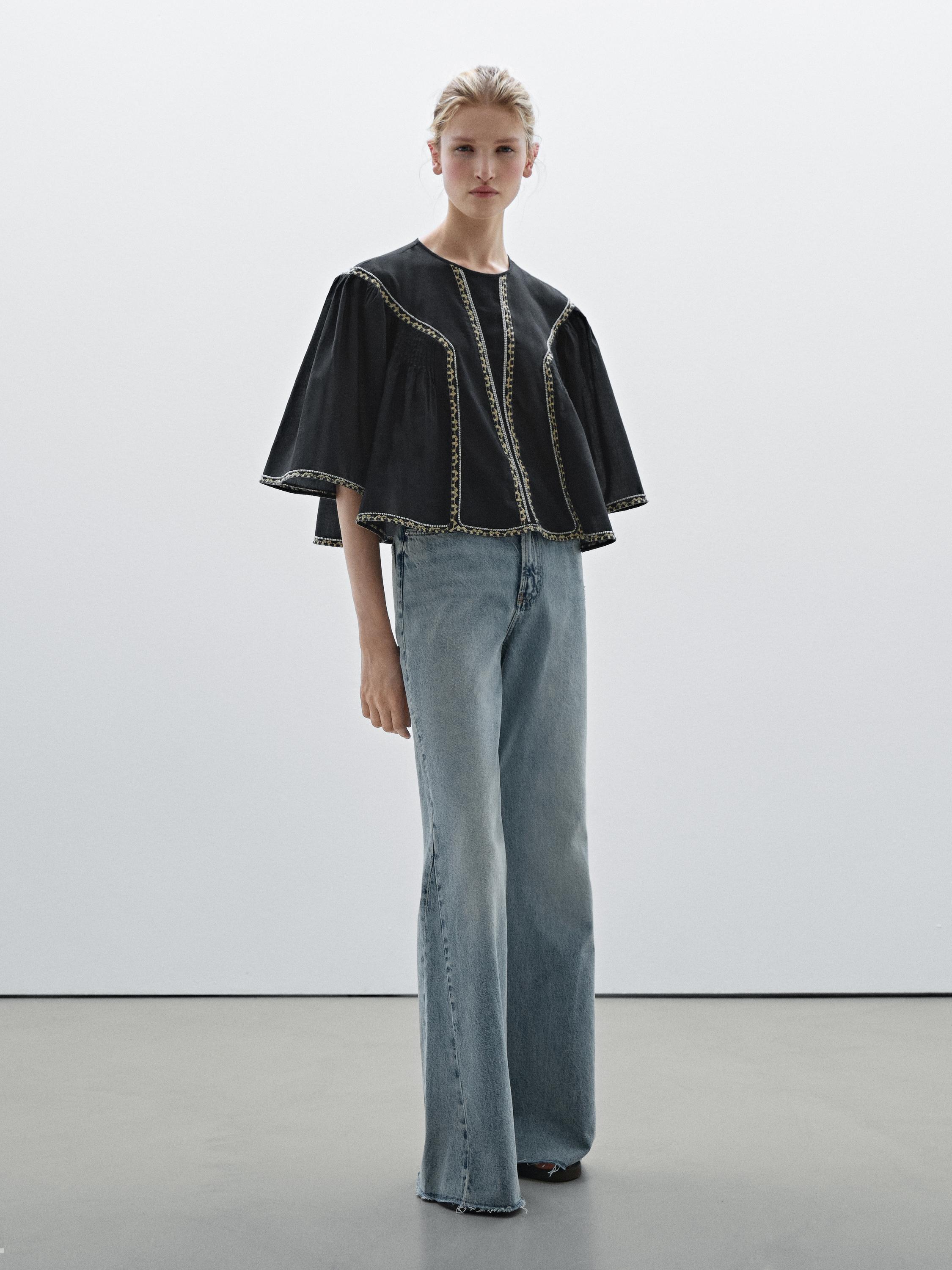 Flowing blouse with embroidered details