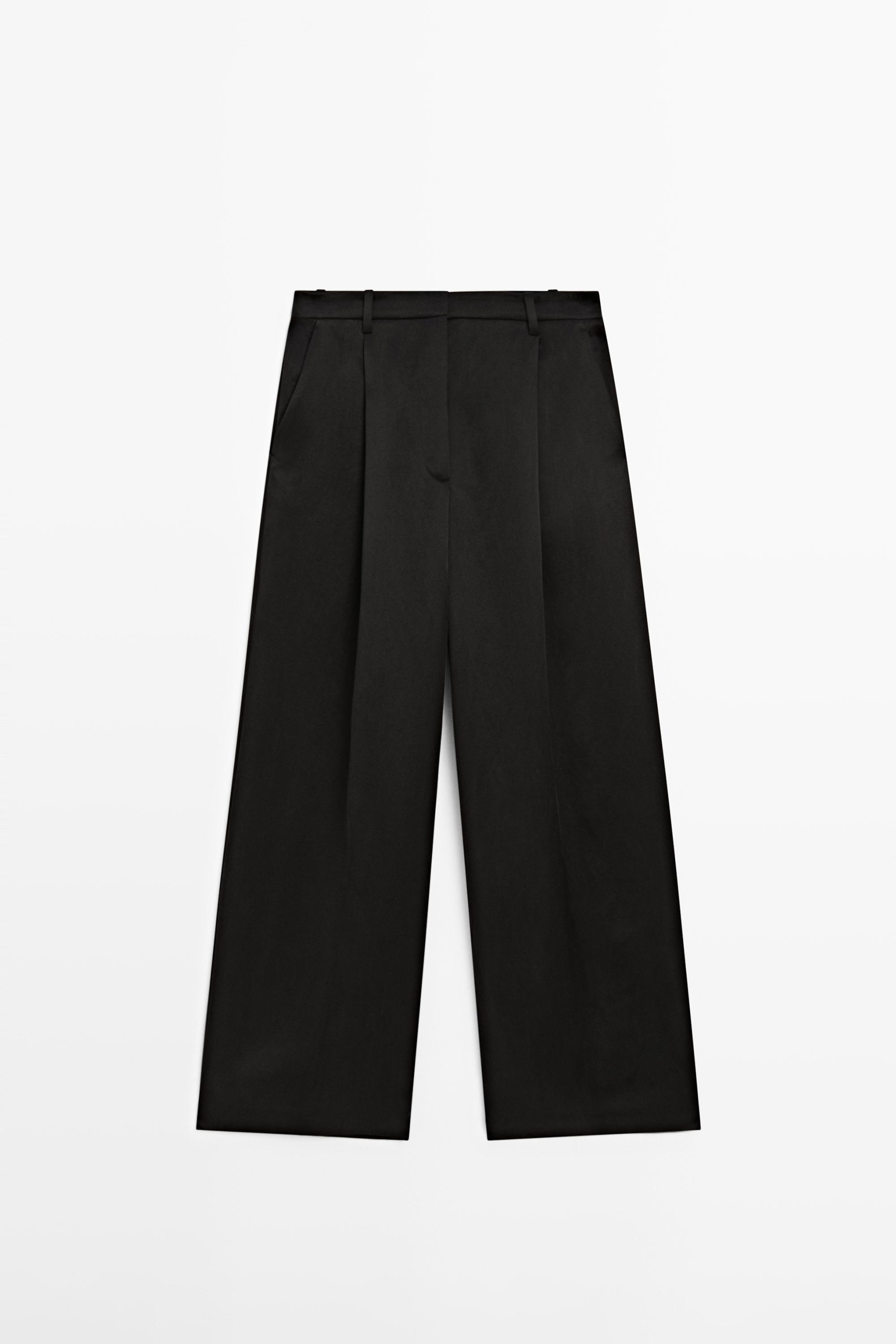 Flowing trousers with pleated details