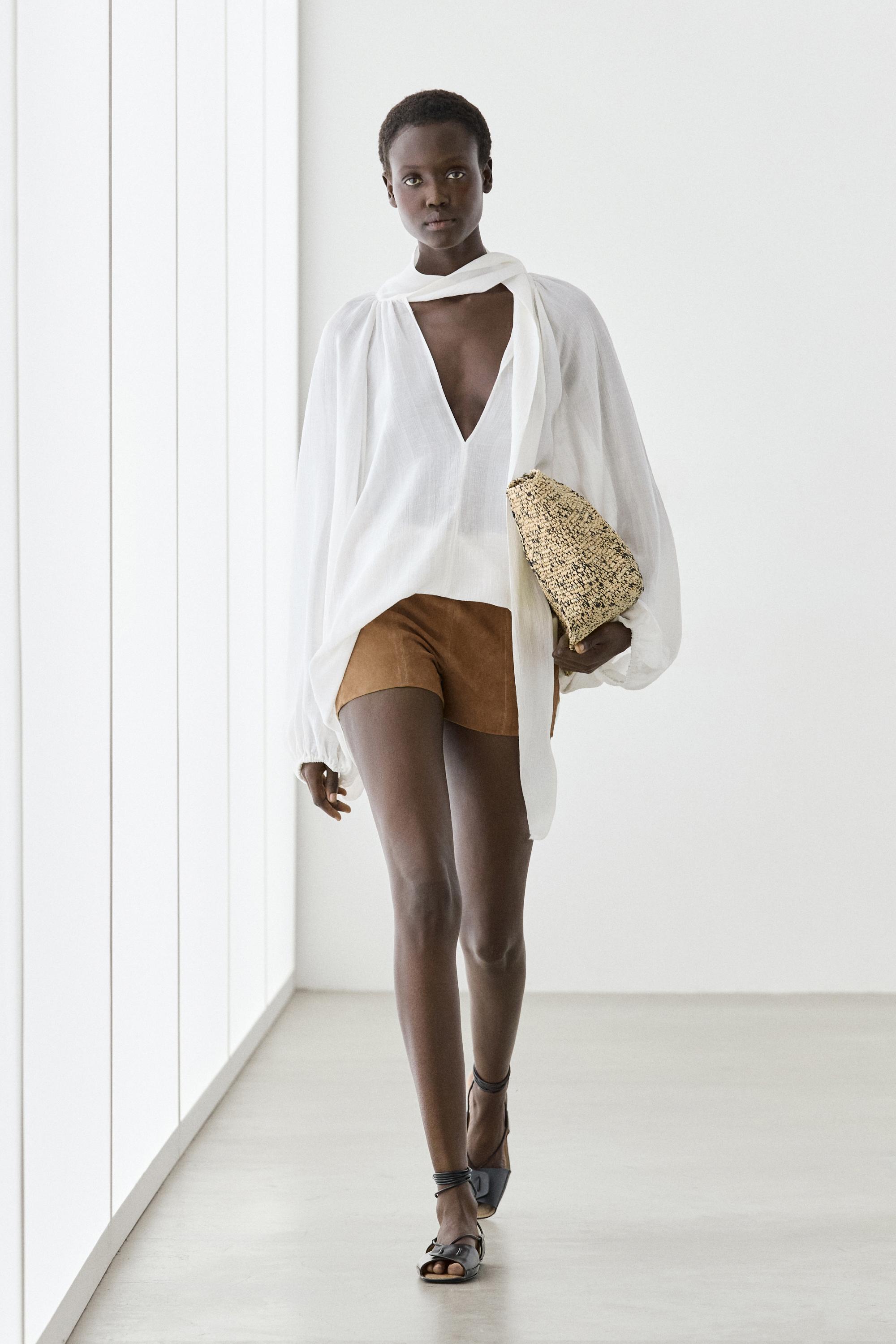 Flowing V-neck blouse with tie
