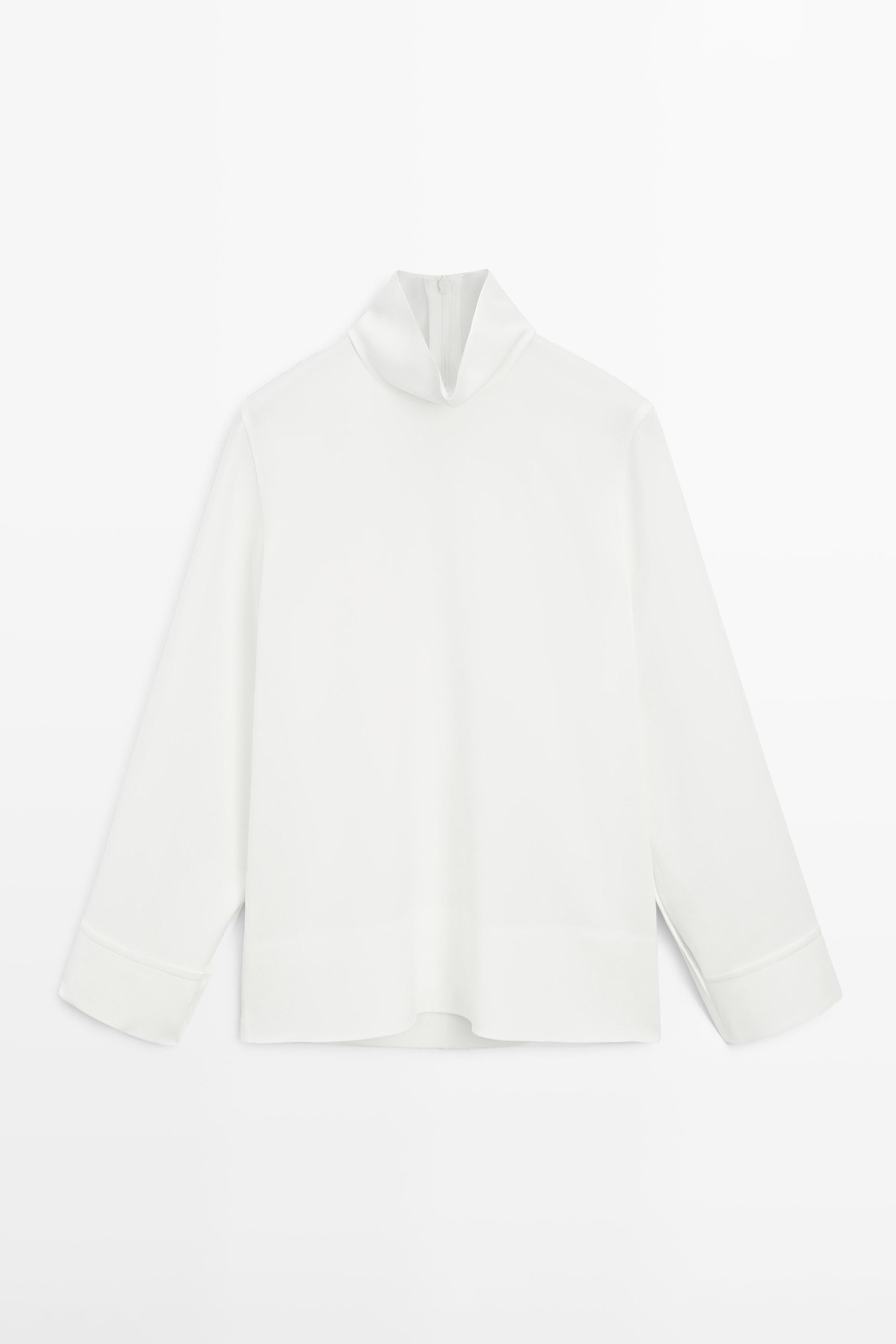 High neck blouse with hem detail