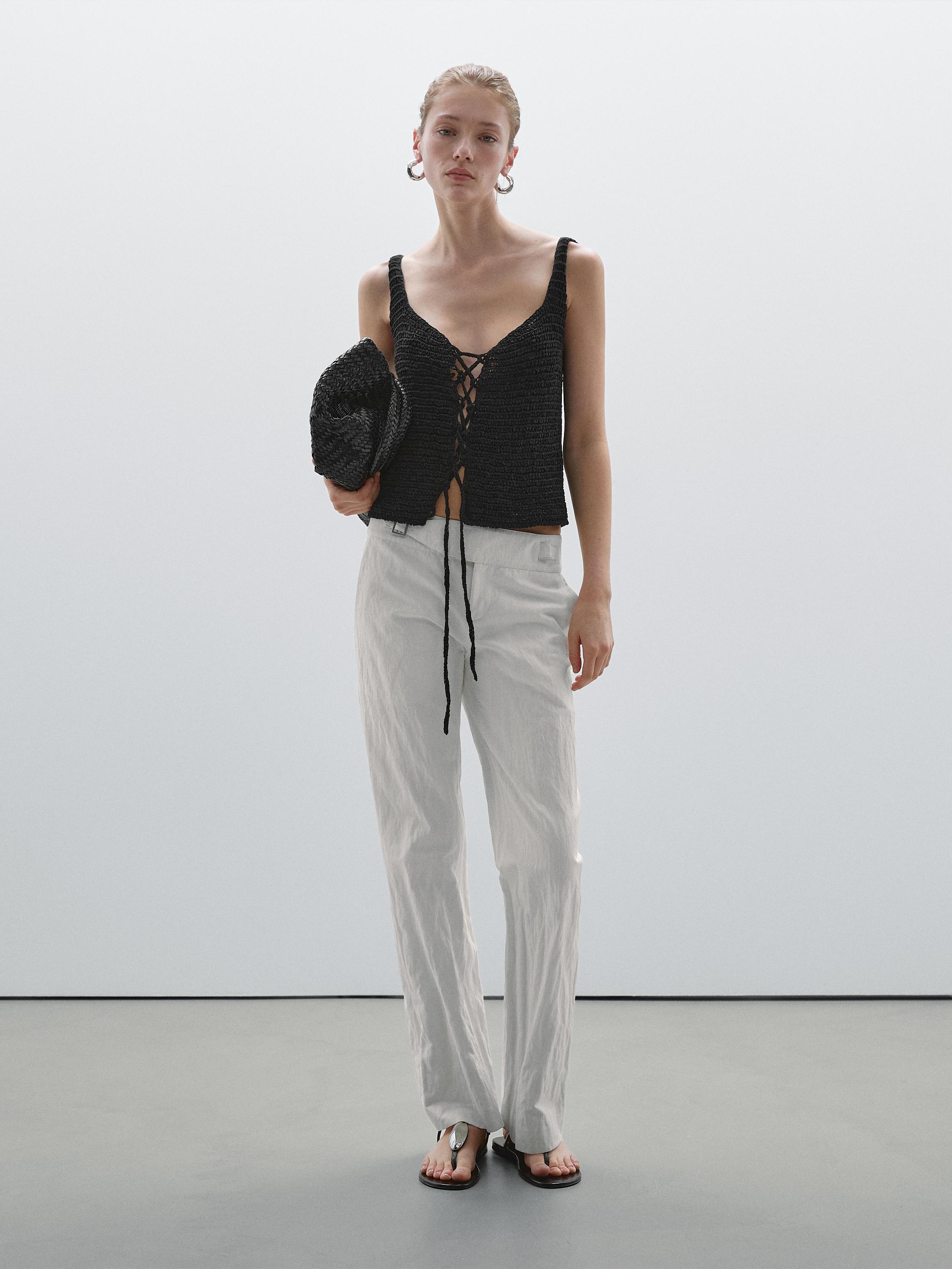 Slim fit low-rise trousers with buckles