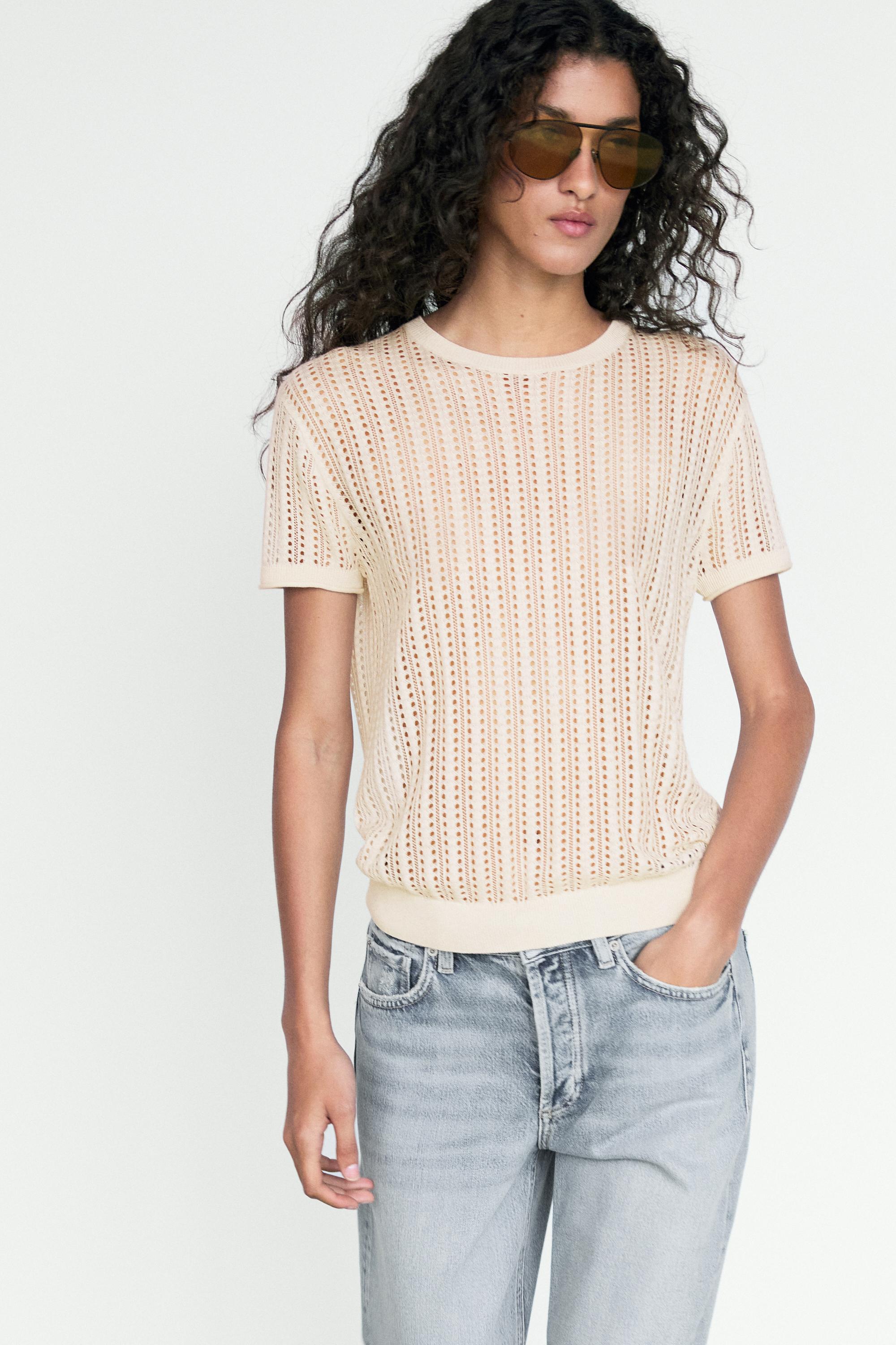 Short sleeve cutwork knit top