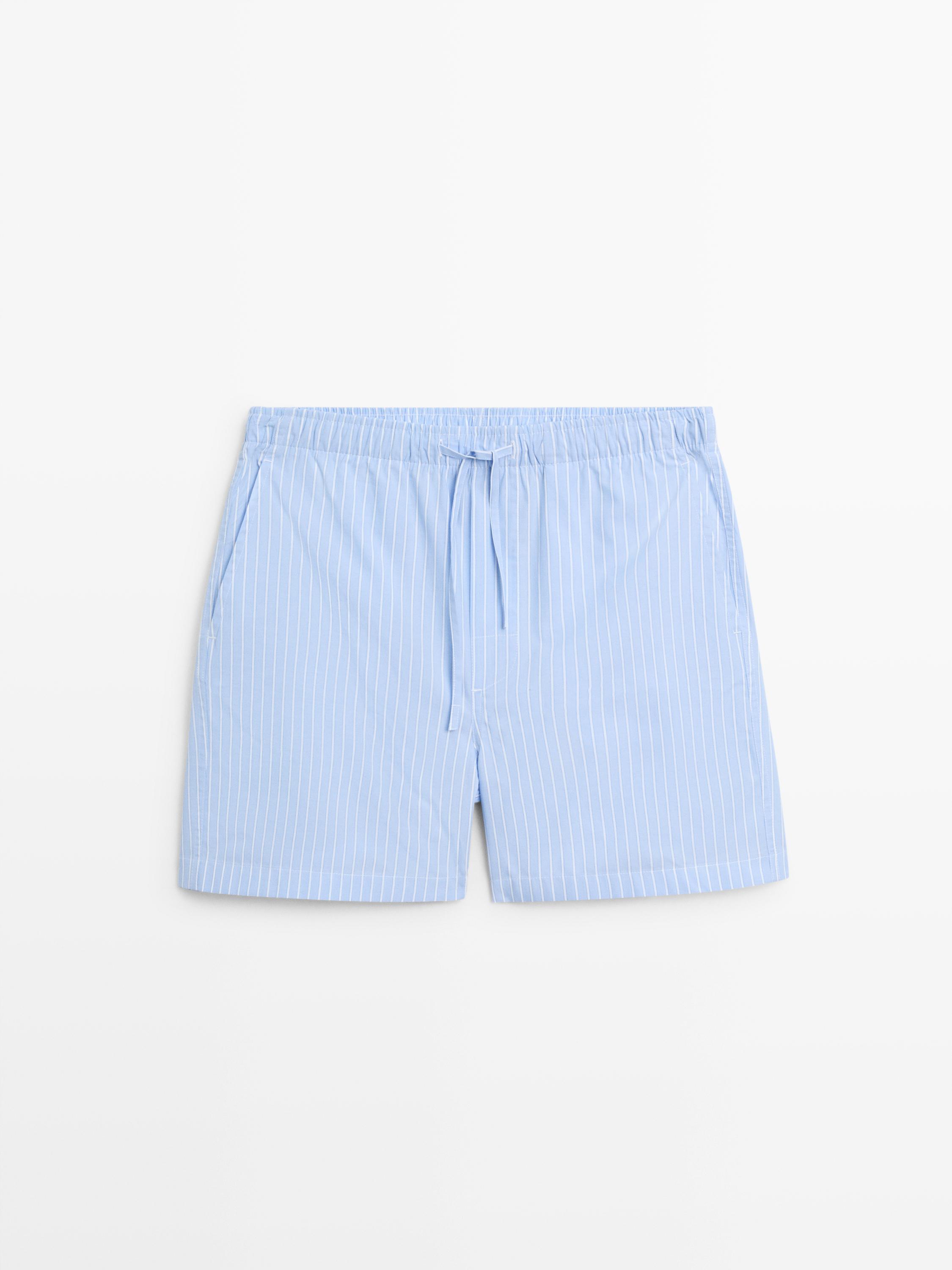 Short sleeve pyjama top and striped trousers