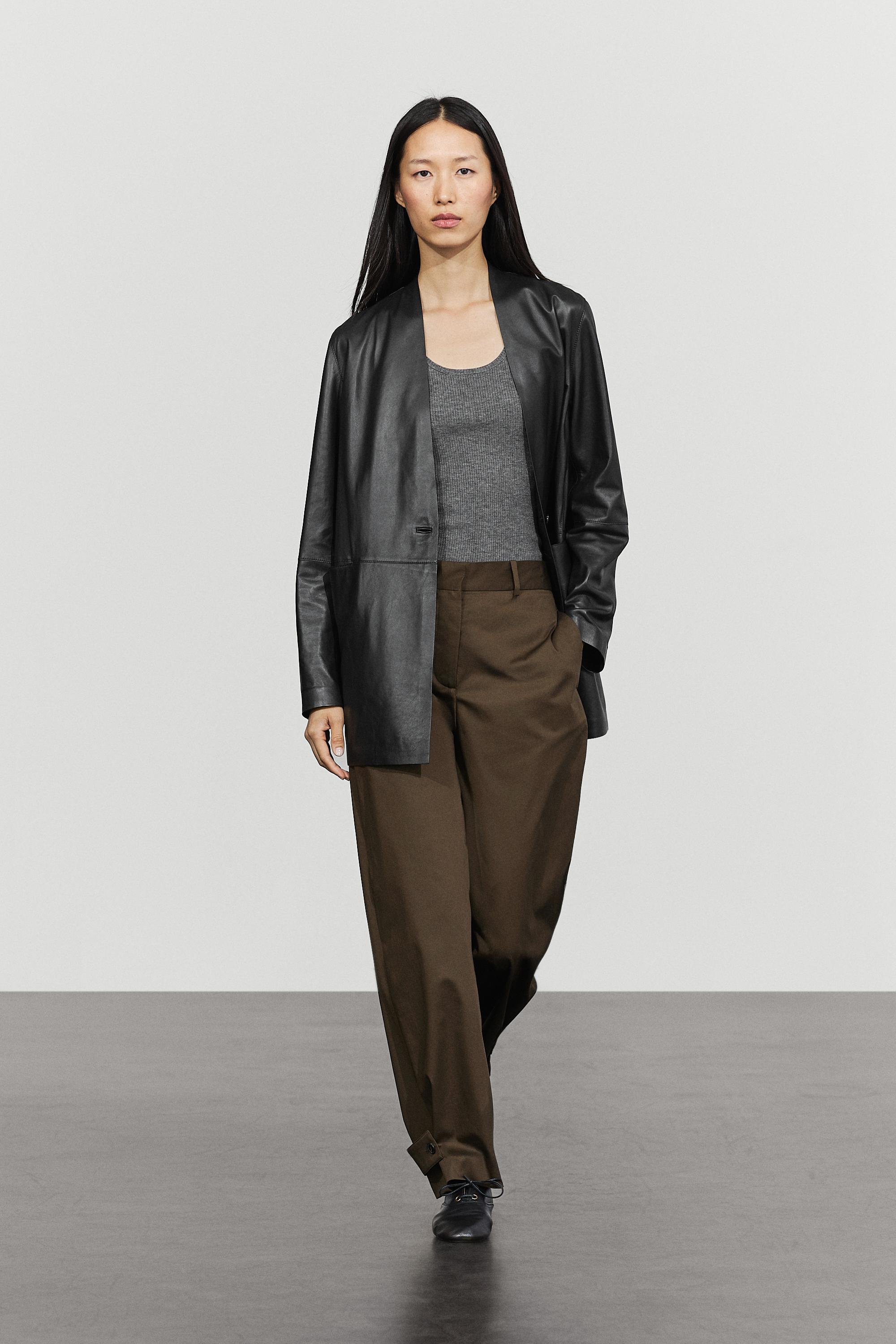 Pants with button-tab hem detail