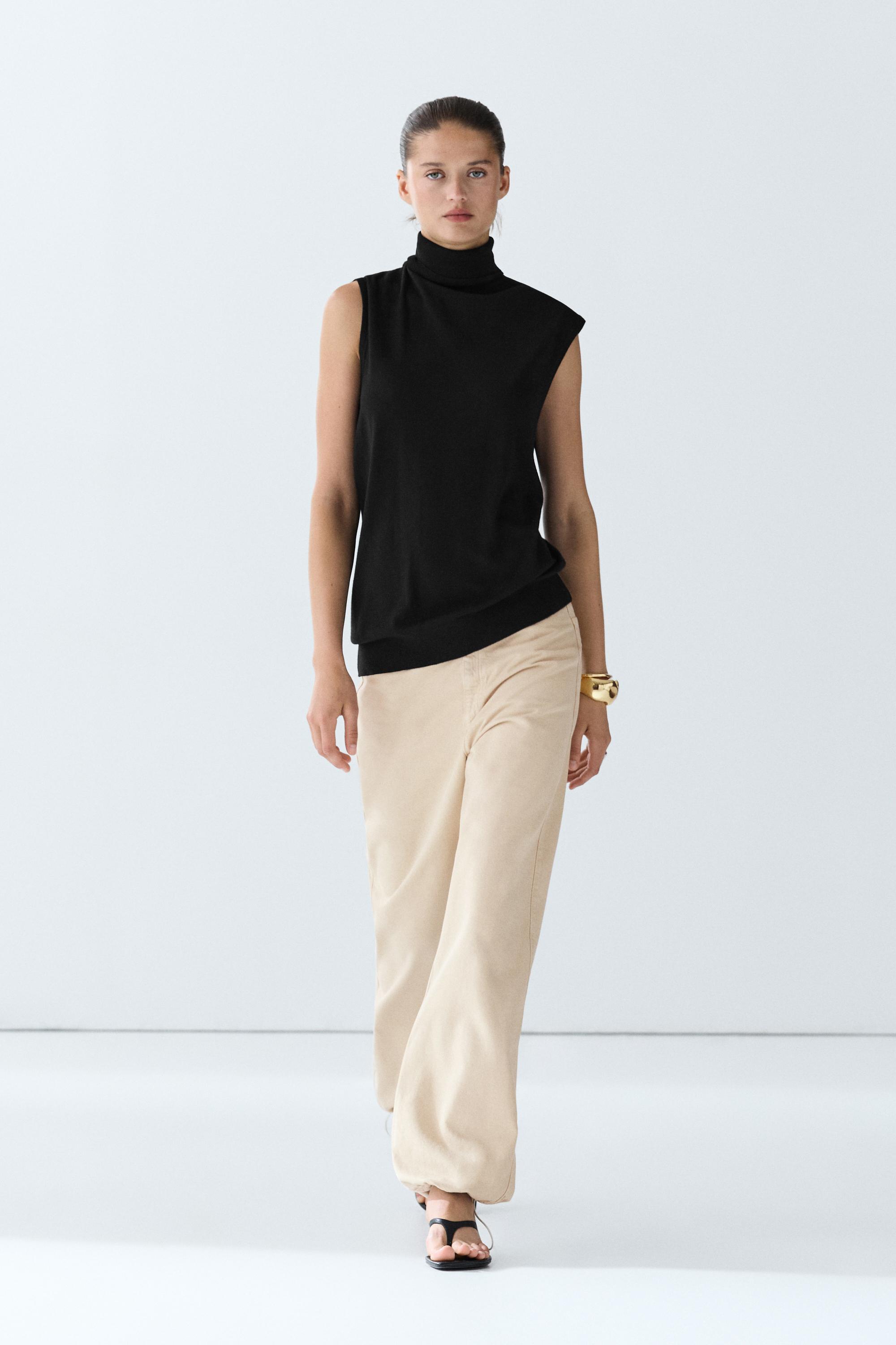 Asymmetric hem turtleneck top