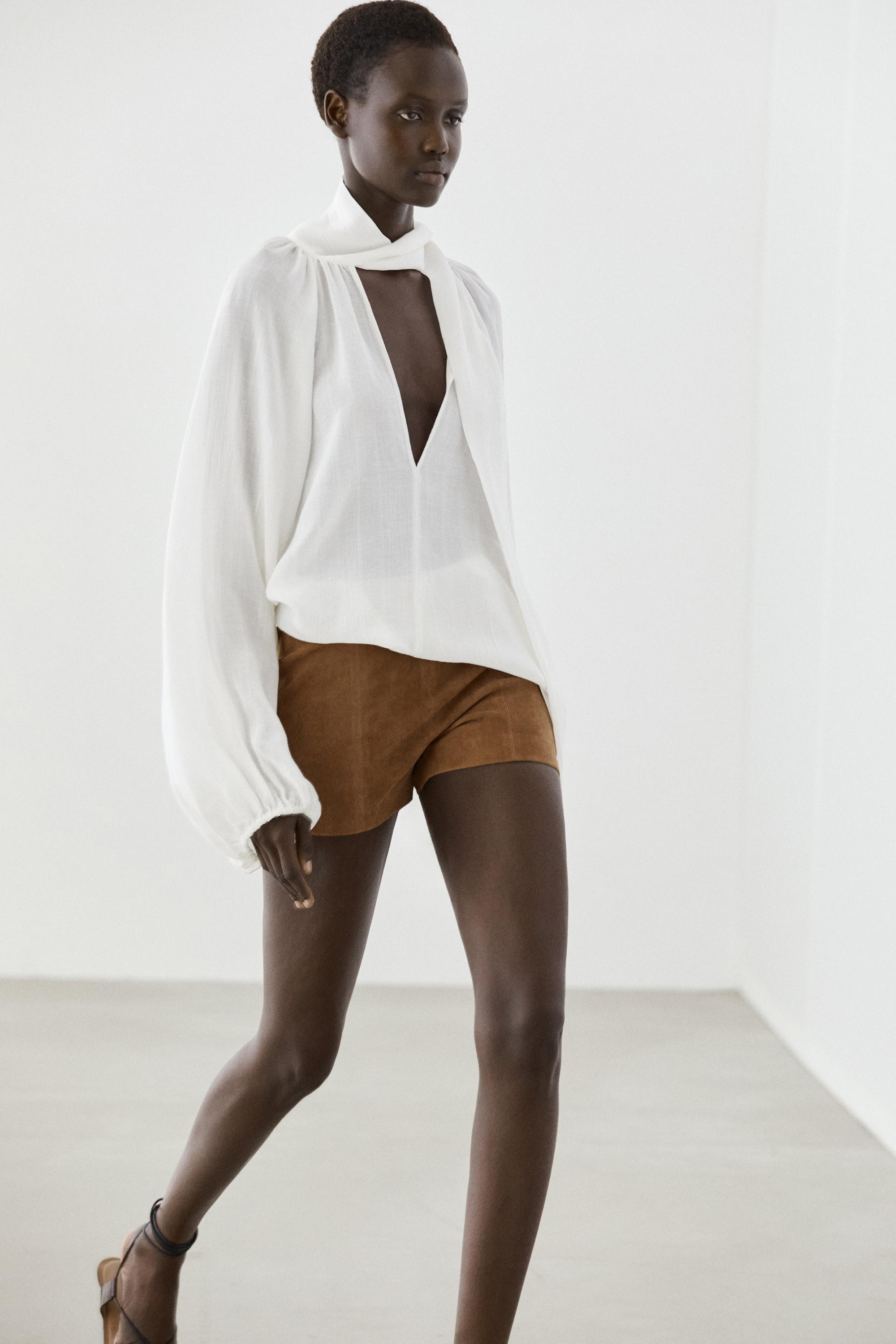 Flowing V-neck blouse with tie