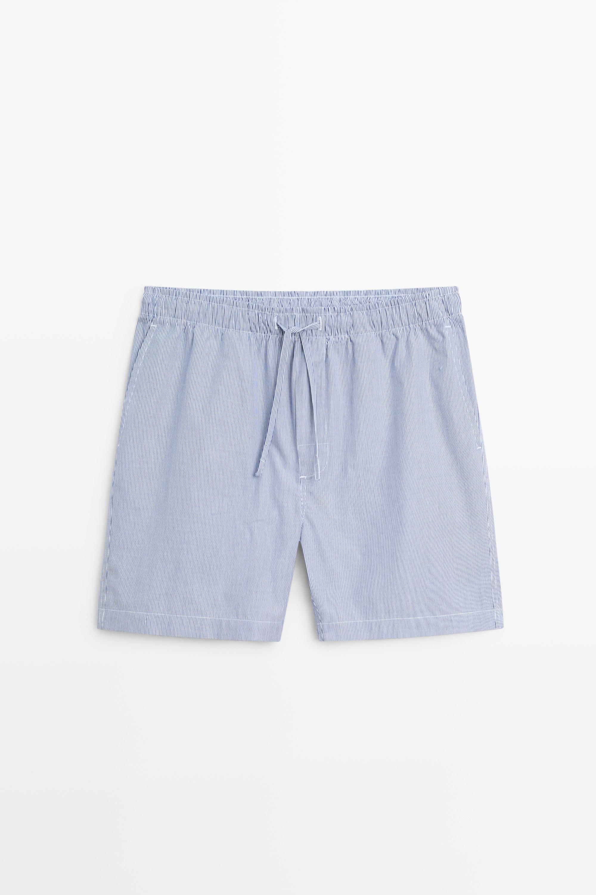Short sleeve pyjama top and striped trousers