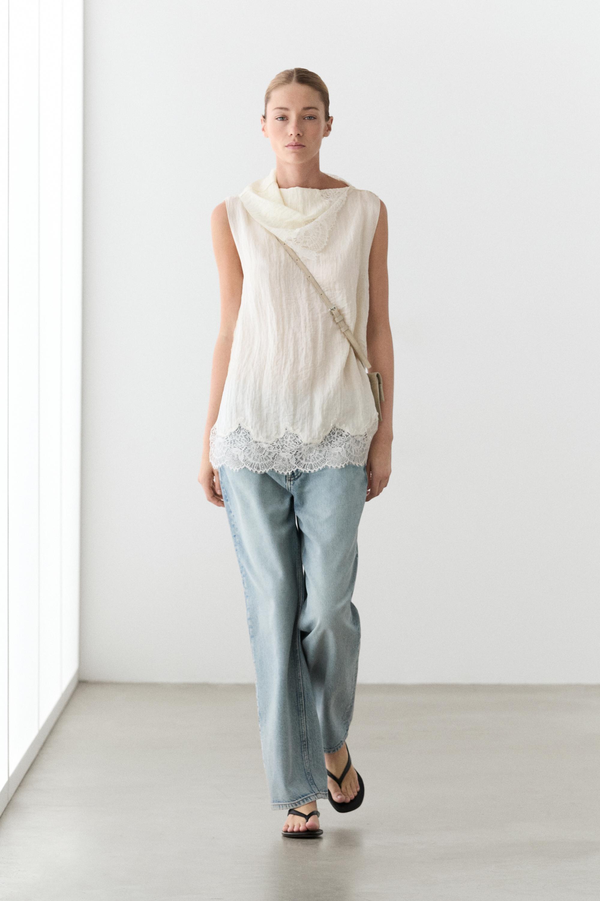 Asymmetric roll neck top with lace detail
