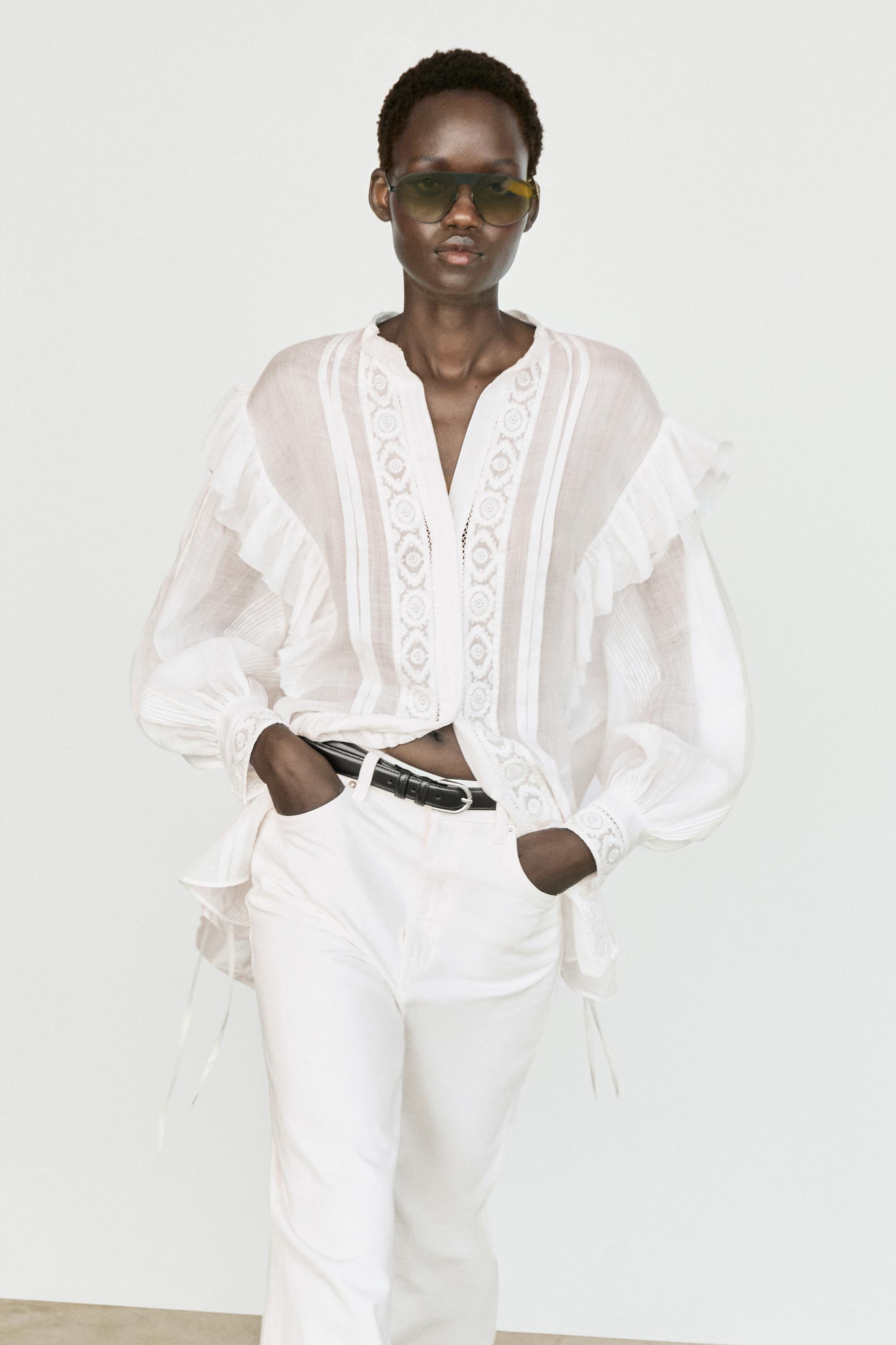 Stand collar blouse with embroidery and ruffles