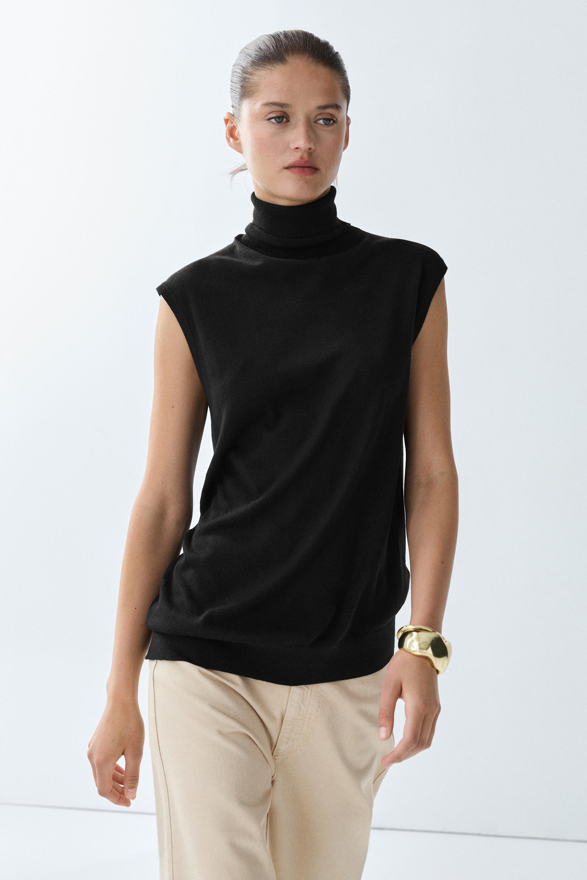 Asymmetric hem turtleneck top