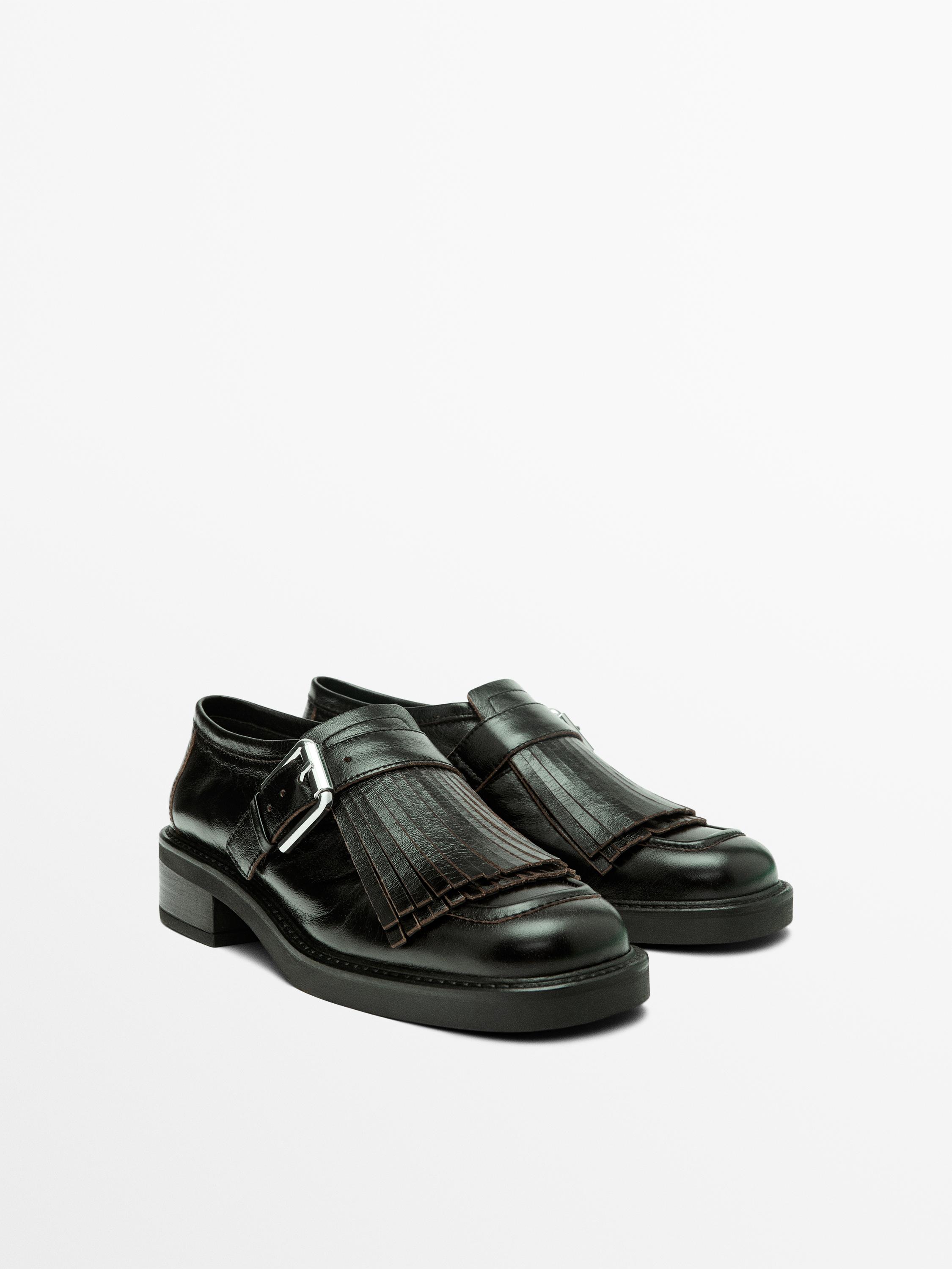 Buckled derby shoes with fringe