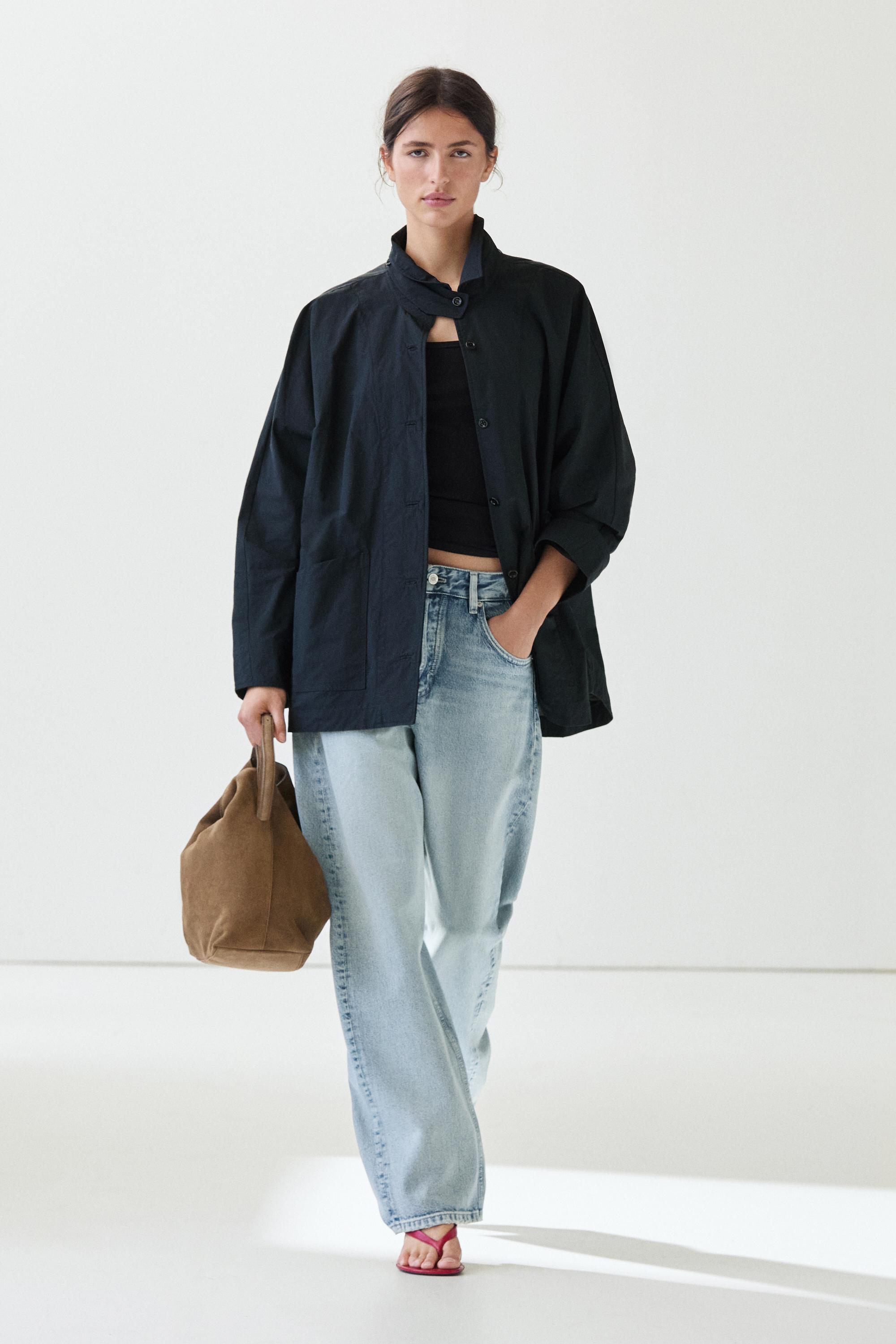 Jacket with buttoned collar strap