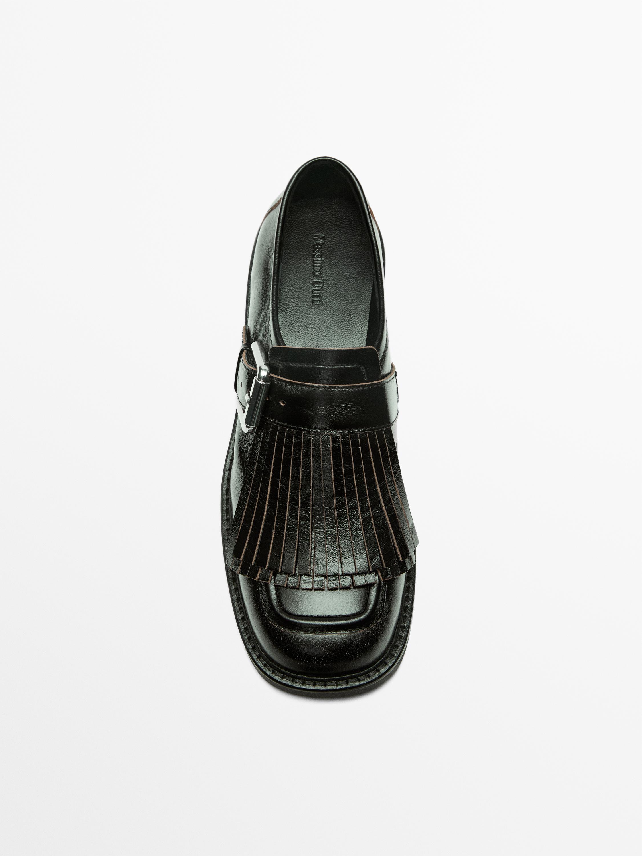 Buckled derby shoes with fringe