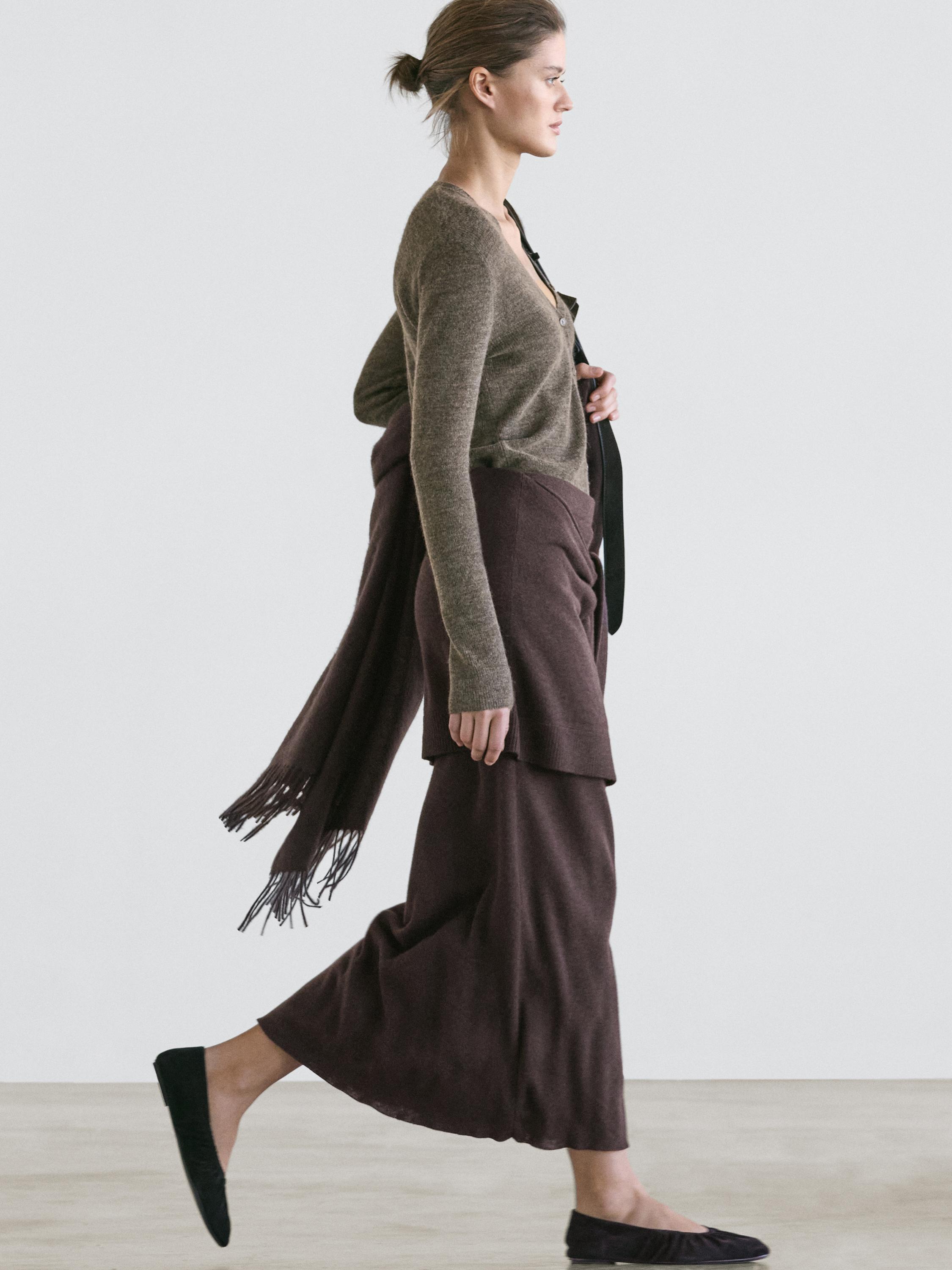 Knit skirt with knotted sleeve details