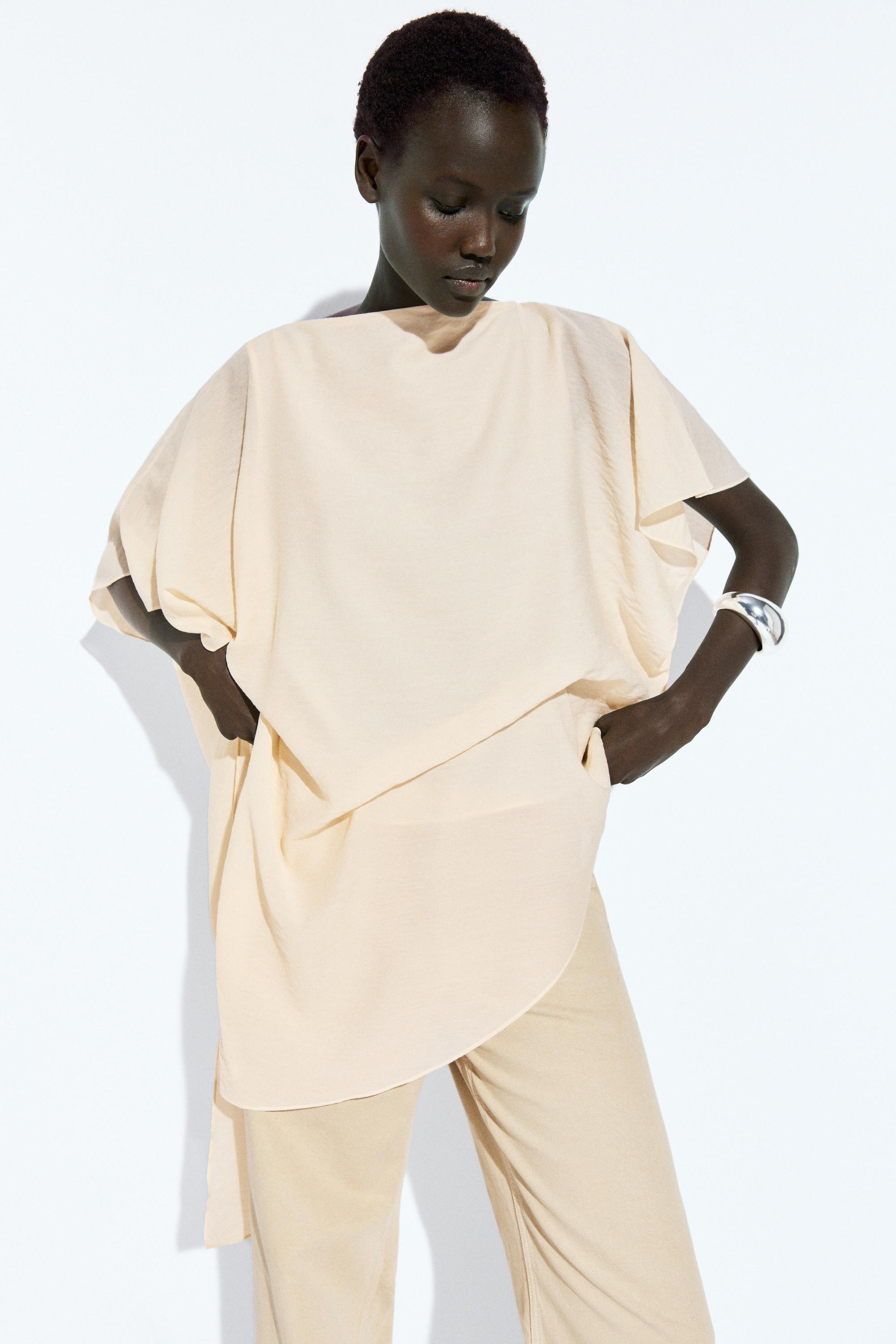 Asymmetric cape-style flowing blouse